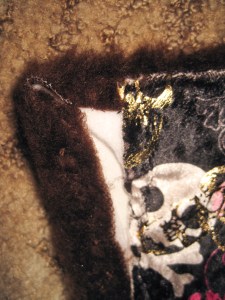 In this version, the fake fur was too thick to fold and I had to cut notches at the corners. This part will not be seen and does not have to look pretty.